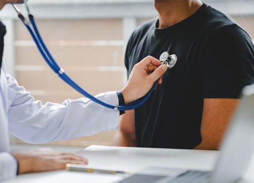 Man receiving Annual Physical Exam in Fullerton CA doctors office