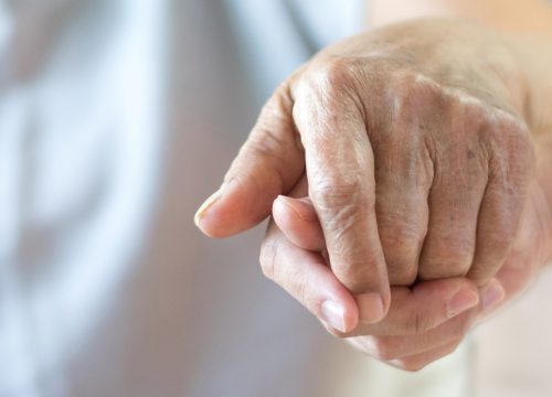 Holding hand of hospice patient in Fullerton CA