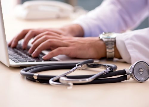 Doctor on his computer providing Telemedicine in Fullerton CA