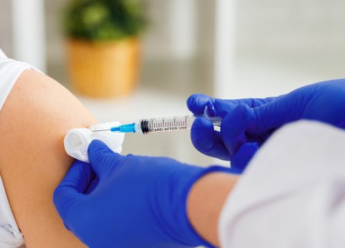 Doctor giving Immunizations and Vaccinations to a patient in Fullerton CA