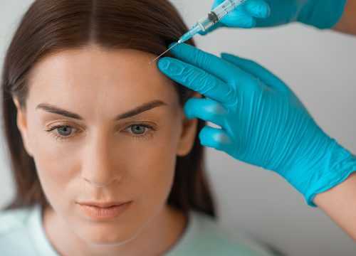 Woman receiving Xeomin Neuromodulator in Fullerton for forehead wrinkles